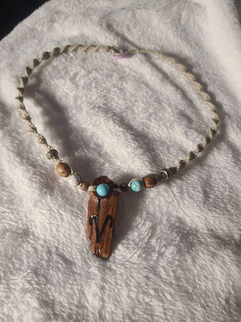 Hemp necklace with a driftwood pendant wood-burned with an Aries symbol, with turquoise and wood beads